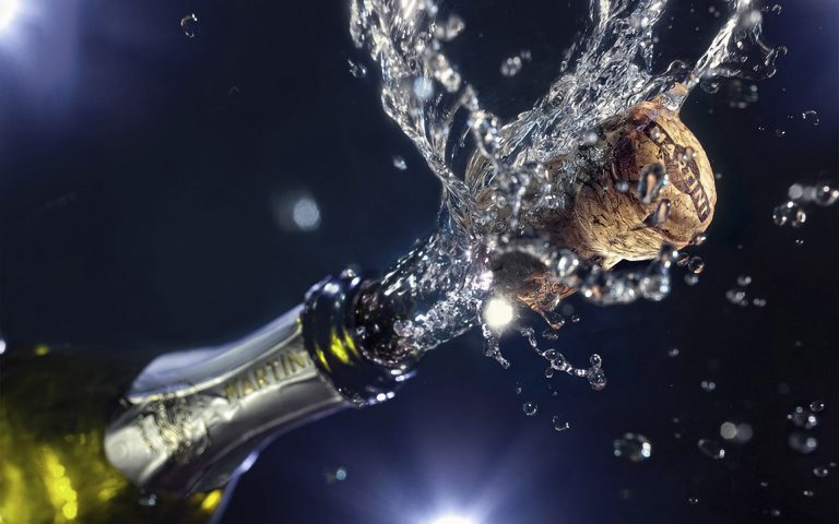 Why do we celebrate with champagne or sparkling wine?