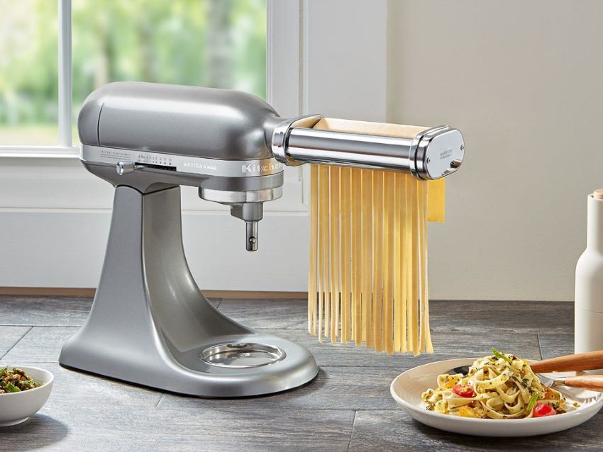 Nevku roller and cutter pasta attachments connected to a KitchenAid mixer for pasta making.